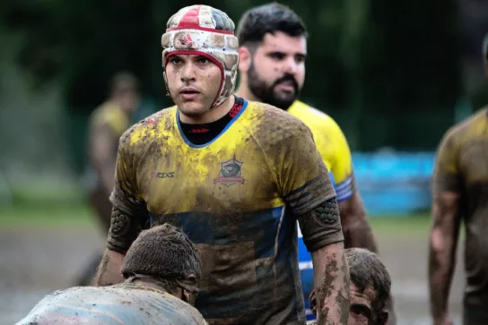 Muddy rugby players